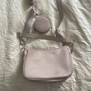 Beige nylon shoulder bag with cross body strap and silver hardware and pouch